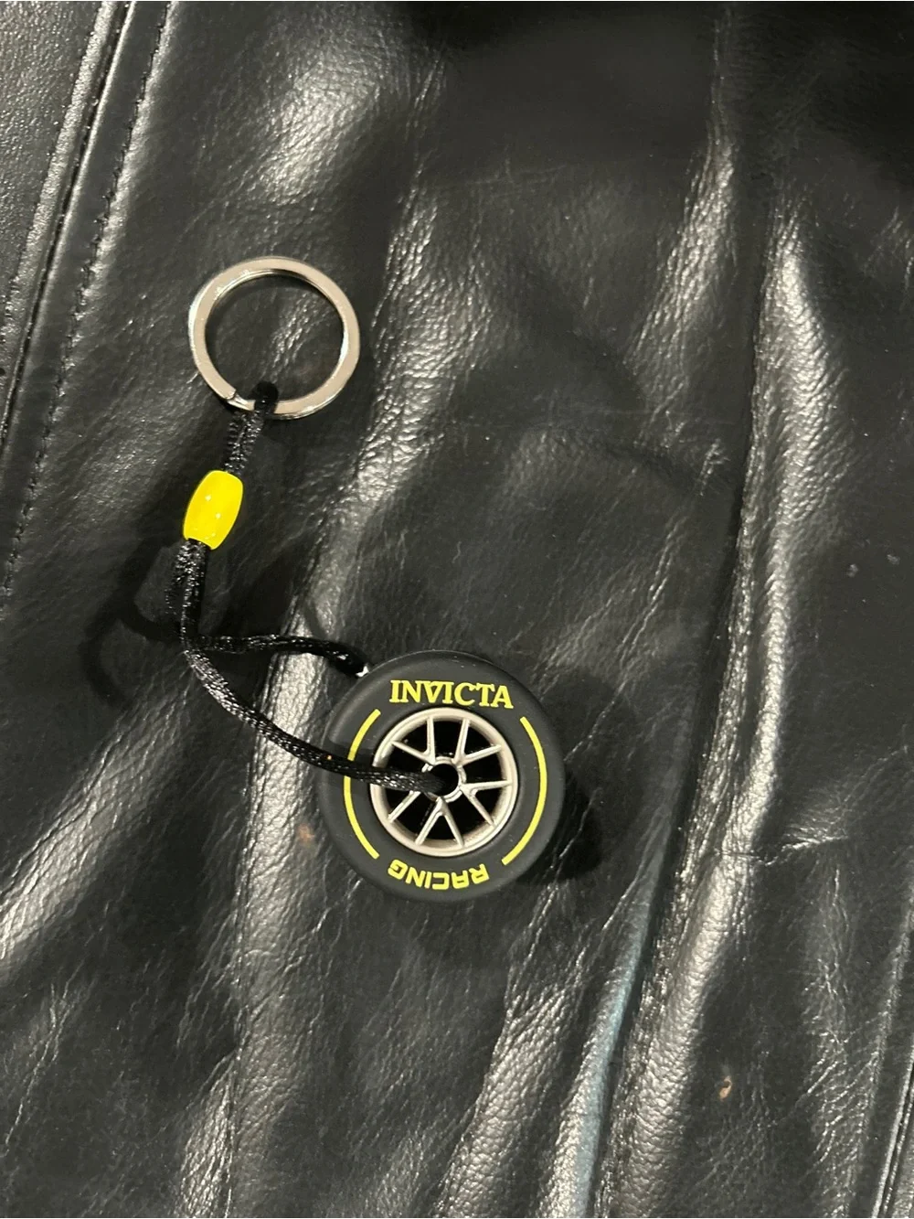 Invicta Black tire Keychain with Yellow Accent